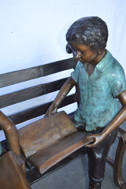 Boy And Girl Reading Books on Bench Bronze Statue -  Size: 48"L x 29"W x 39"H.