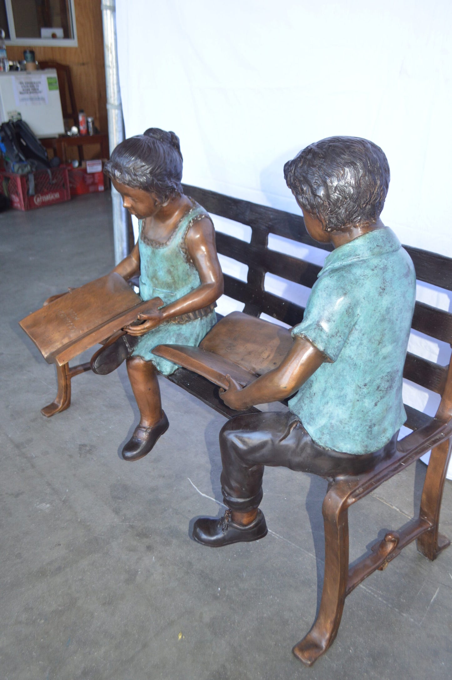 Boy And Girl Reading Books on Bench Bronze Statue -  Size: 48"L x 29"W x 39"H.