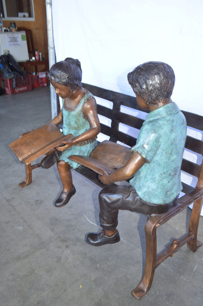 Boy And Girl Reading Books on Bench Bronze Statue -  Size: 48"L x 29"W x 39"H.