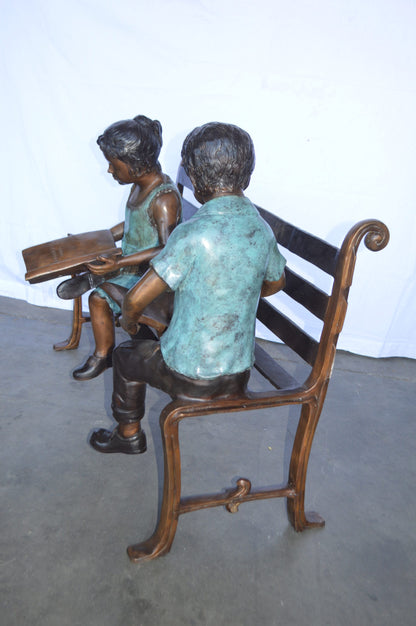 Boy And Girl Reading Books on Bench Bronze Statue -  Size: 48"L x 29"W x 39"H.