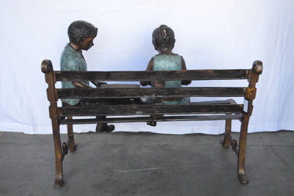Boy And Girl Reading Books on Bench Bronze Statue -  Size: 48"L x 29"W x 39"H.