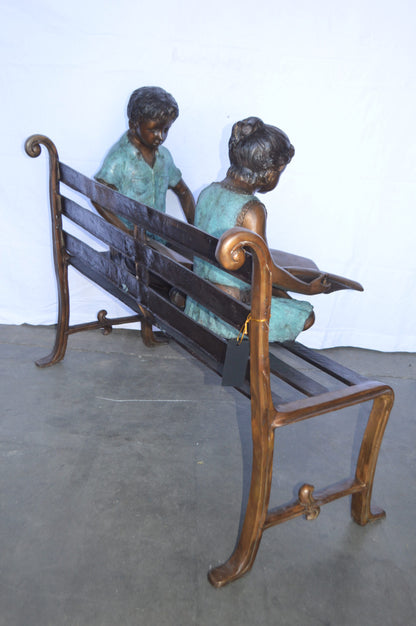 Boy And Girl Reading Books on Bench Bronze Statue -  Size: 48"L x 29"W x 39"H.