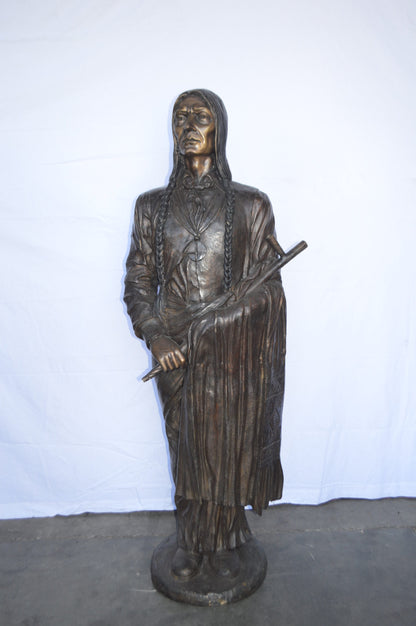 Indian Holding a Pipe Bronze Statue Life Size -  Size: 26"L x 14"W x 68"H.