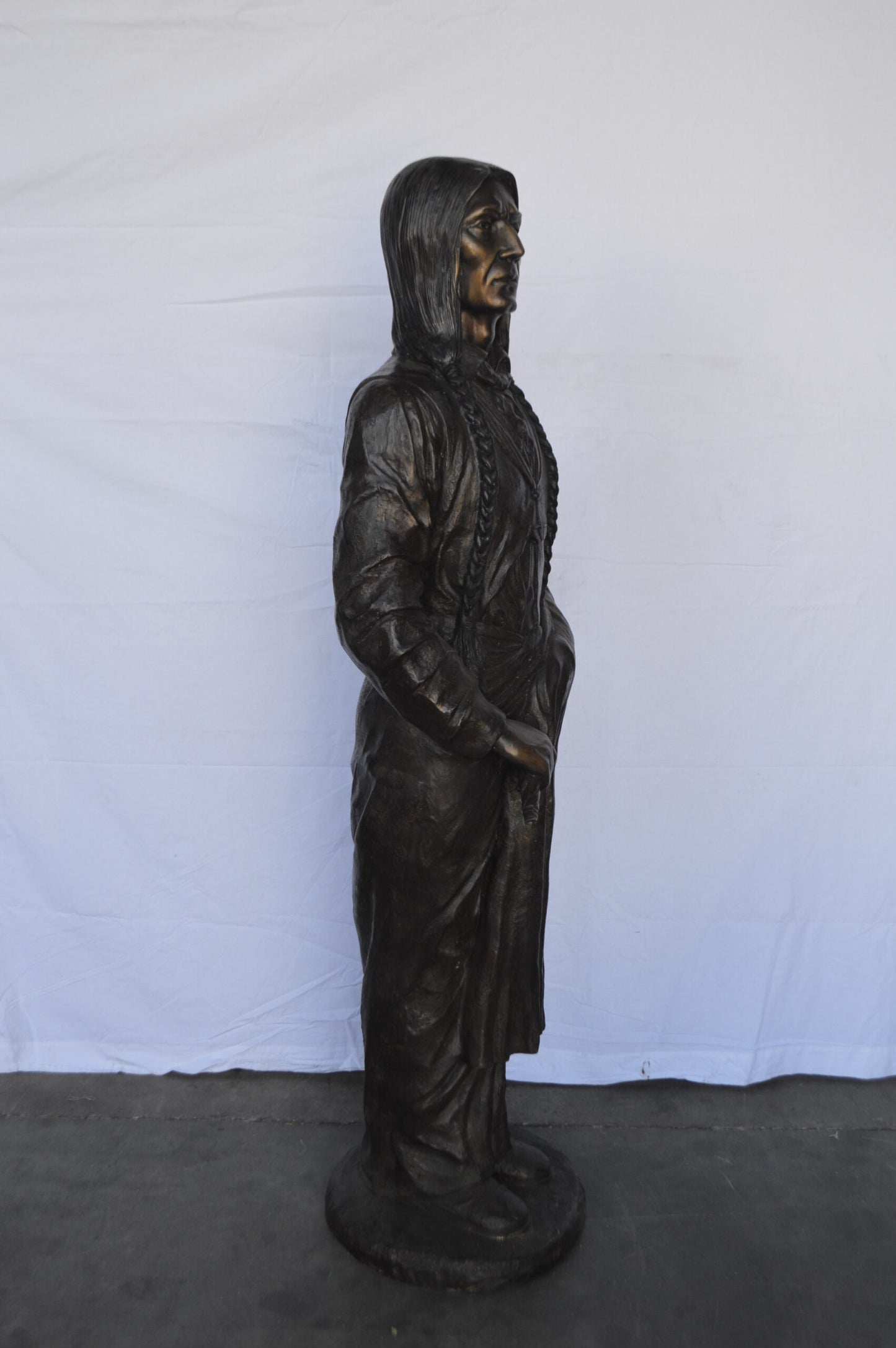 Indian Holding a Pipe Bronze Statue Life Size -  Size: 26"L x 14"W x 68"H.