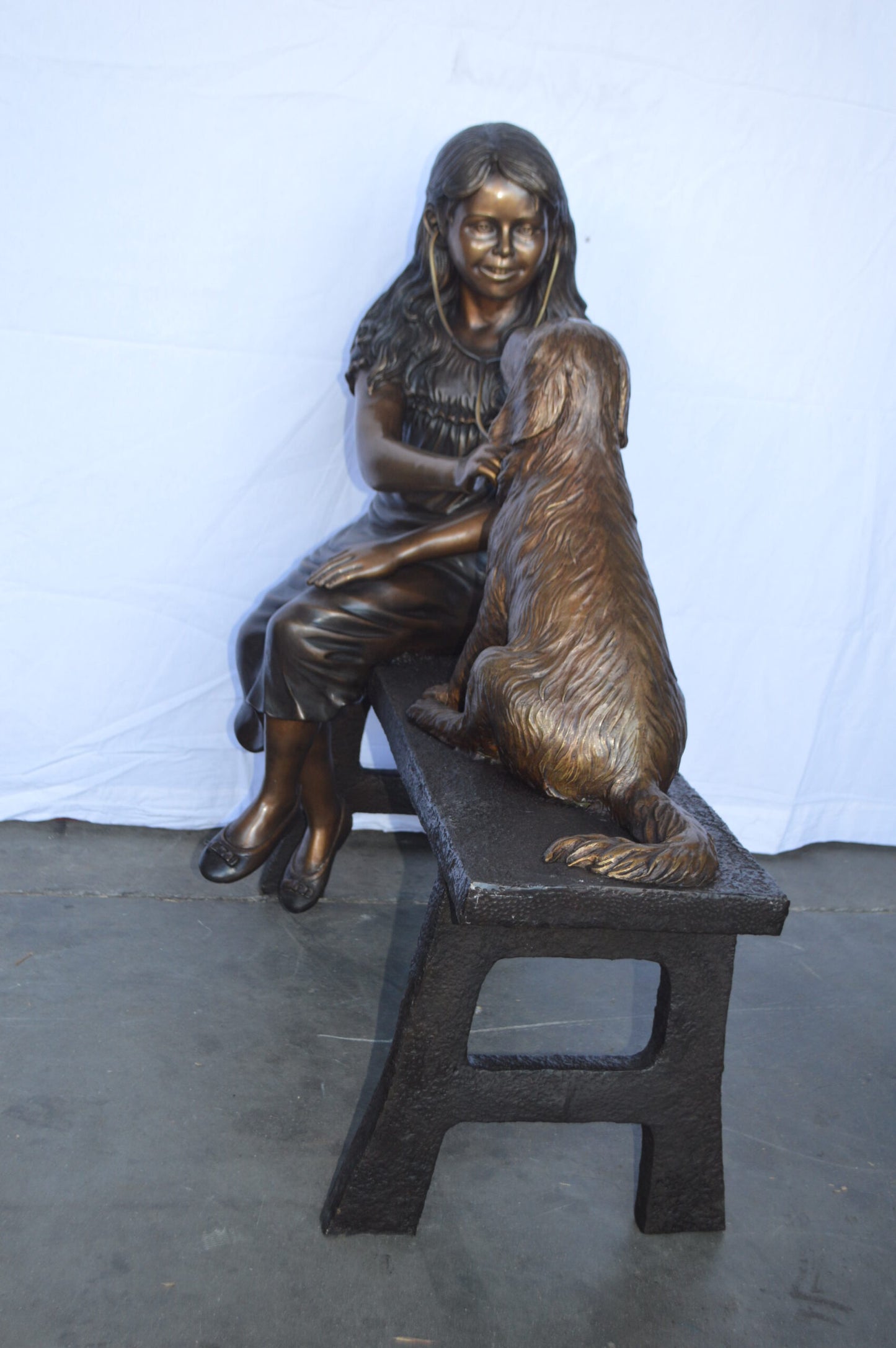 Girl plays Doctor on a Bench W Dog Bronze Statue -  Size: 38"L x 18"W x 39"H.