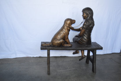 Girl plays Doctor on a Bench W Dog Bronze Statue -  Size: 38"L x 18"W x 39"H.