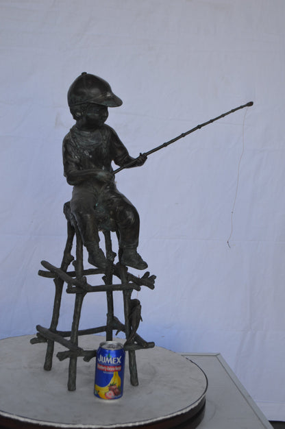 A Boy on a high Chair Fishing Bronze Statue -  Size: 16"L x 14"W x 28"H.