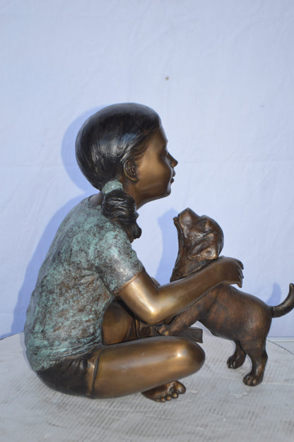 Girl Petting her Dog While Reading Bronze Statue -  Size: 13"L x 18"W x 18"H.