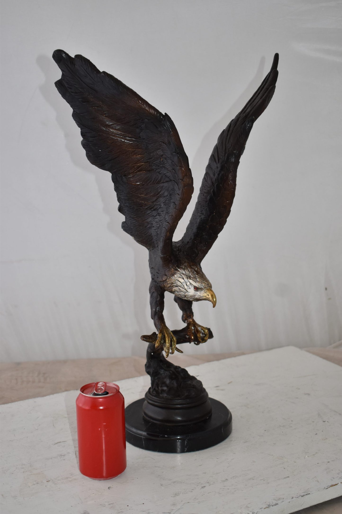 Eagle Holding His Fish Prey Flying Away Bronze Statue Size: 14" x 11" x 23"H
