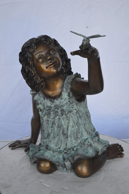 Girl Playing With Butterfly Bronze Statue -  Size: 21"L x 15"W x 19"H.
