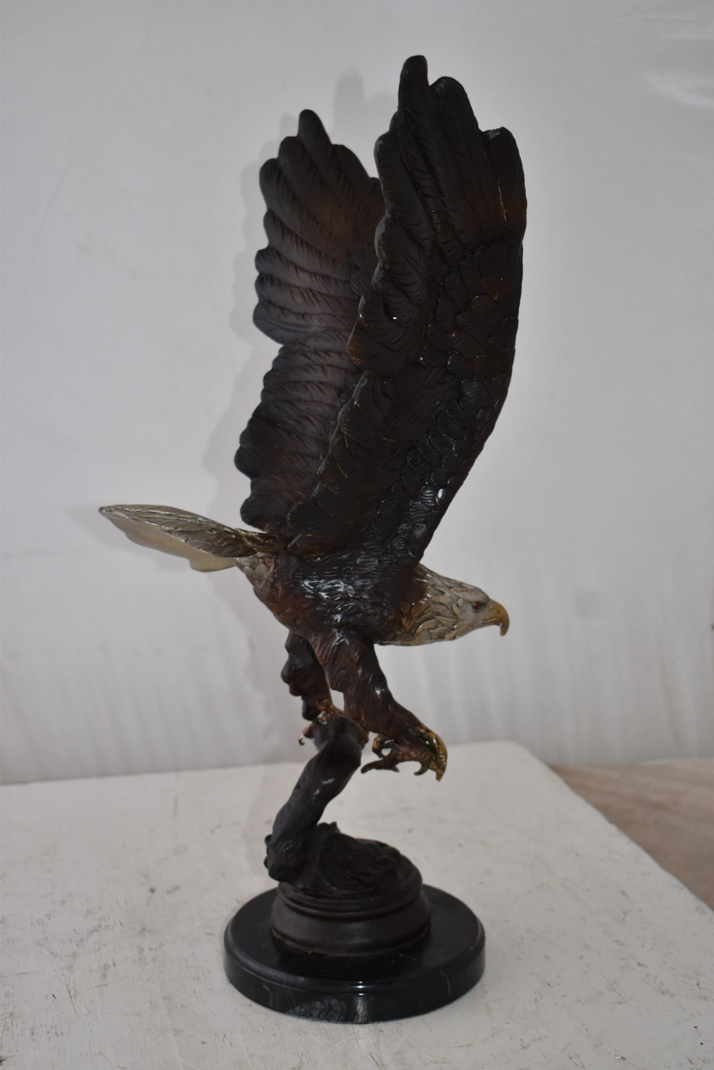 Eagle Holding His Fish Prey Flying Away Bronze Statue Size: 14" x 11" x 23"H