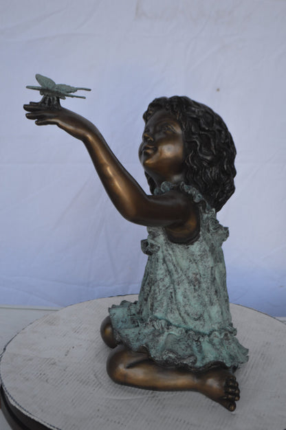 Girl Playing With Butterfly Bronze Statue -  Size: 21"L x 15"W x 19"H.