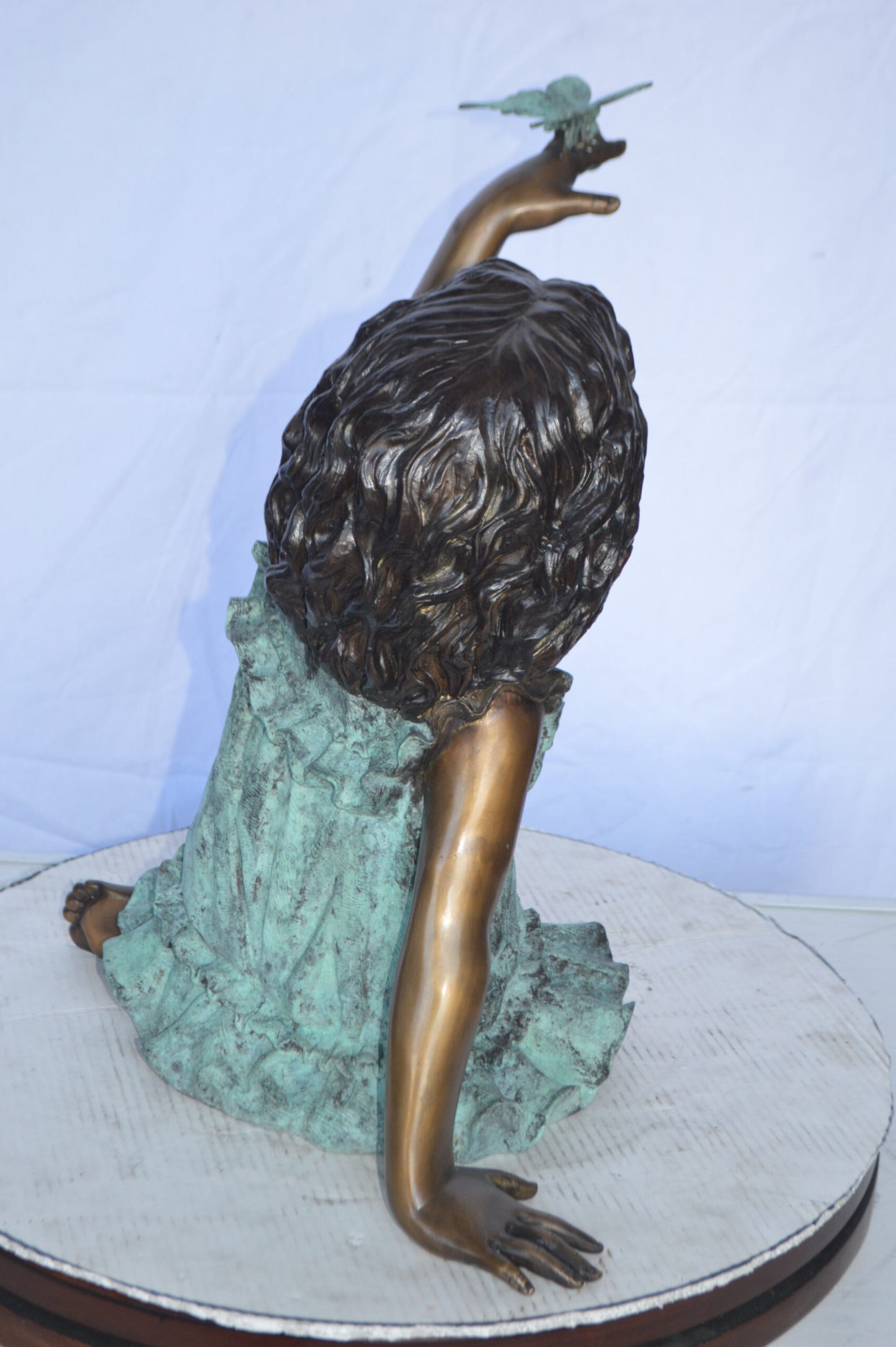 Girl Playing With Butterfly Bronze Statue -  Size: 21"L x 15"W x 19"H.