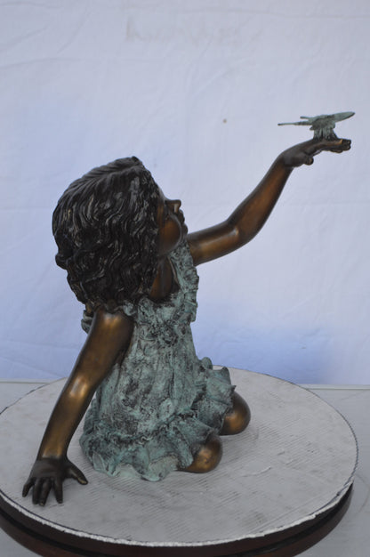 Girl Playing With Butterfly Bronze Statue -  Size: 21"L x 15"W x 19"H.