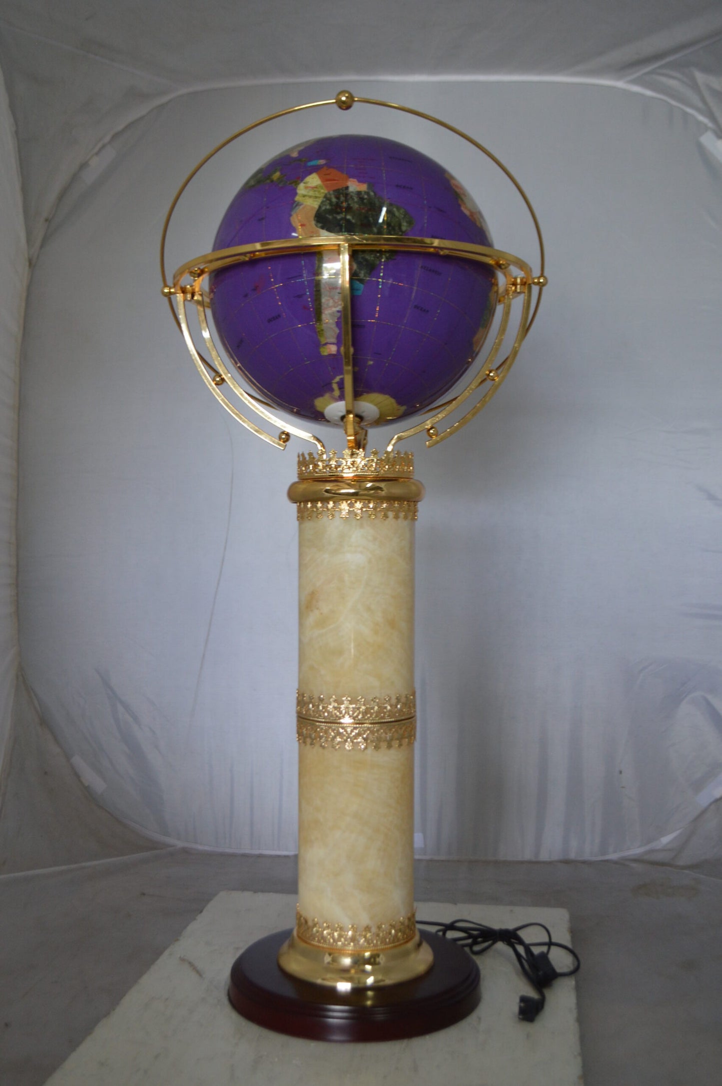 Illuminated Purple World Globe Rotated by motor -  Size: 19"L x 19"W x 42"H.