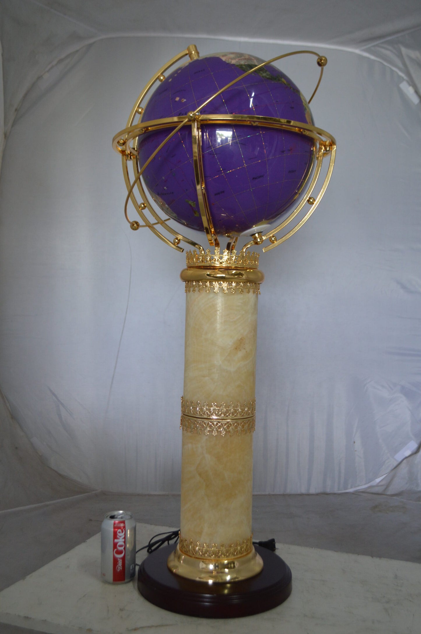 Illuminated Purple World Globe Rotated by motor -  Size: 19"L x 19"W x 42"H.