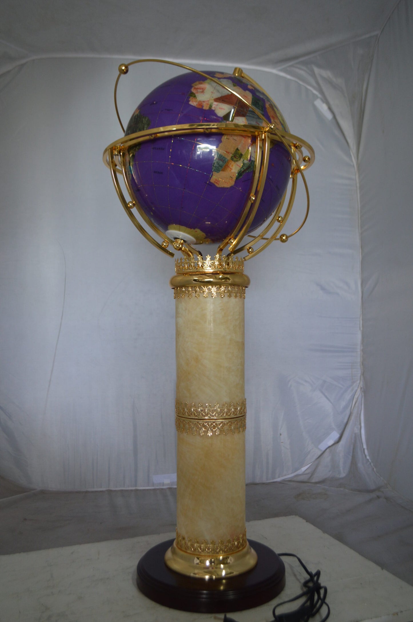 Illuminated Purple World Globe Rotated by motor -  Size: 19"L x 19"W x 42"H.