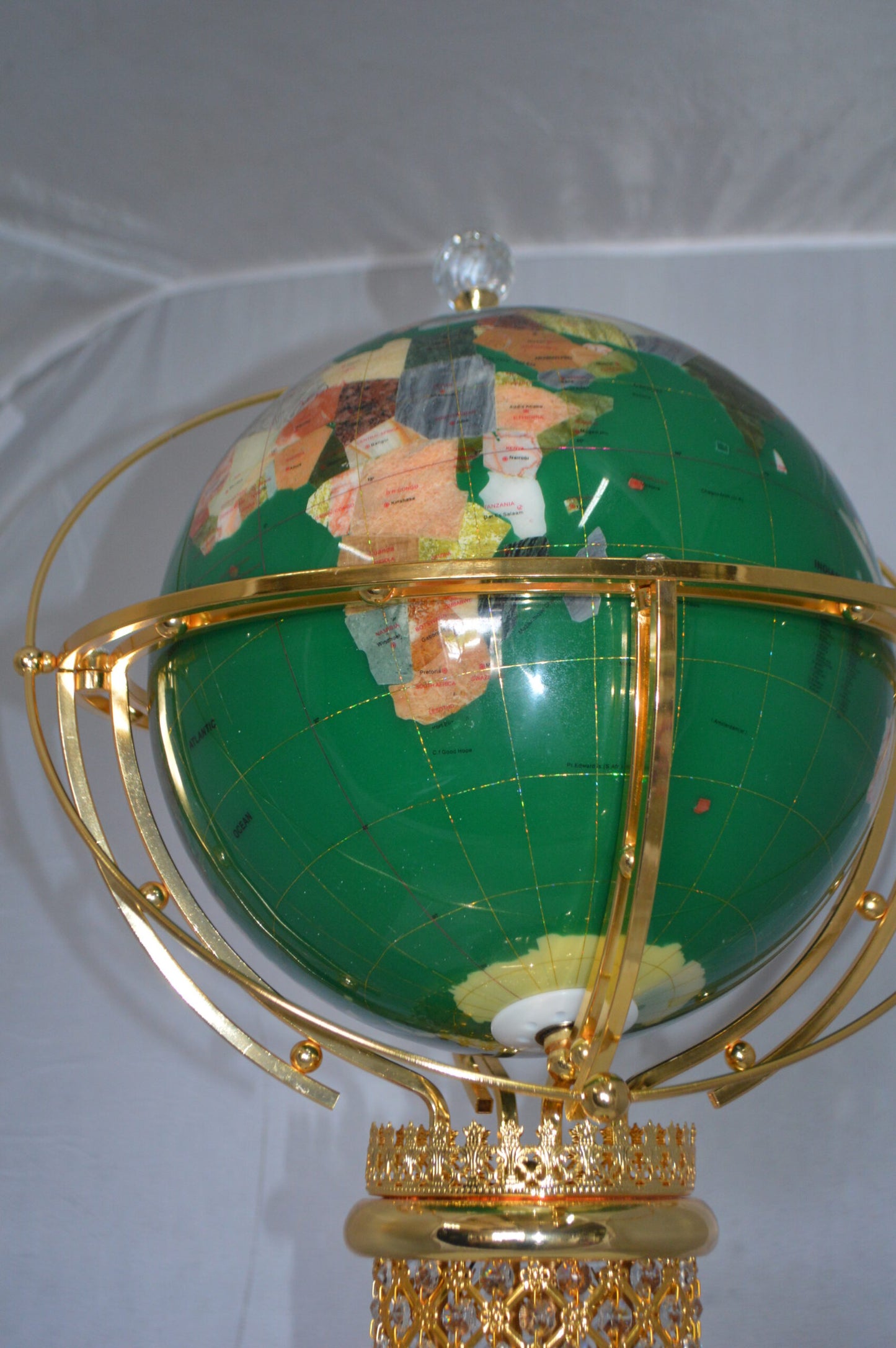 Illuminated Green World Globe Rotated by motor -  Size: 19"L x 19"W x 42"H.