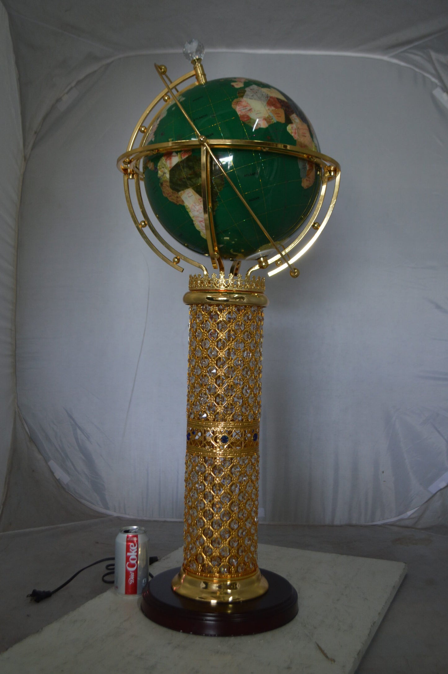Illuminated Green World Globe Rotated by motor -  Size: 19"L x 19"W x 42"H.