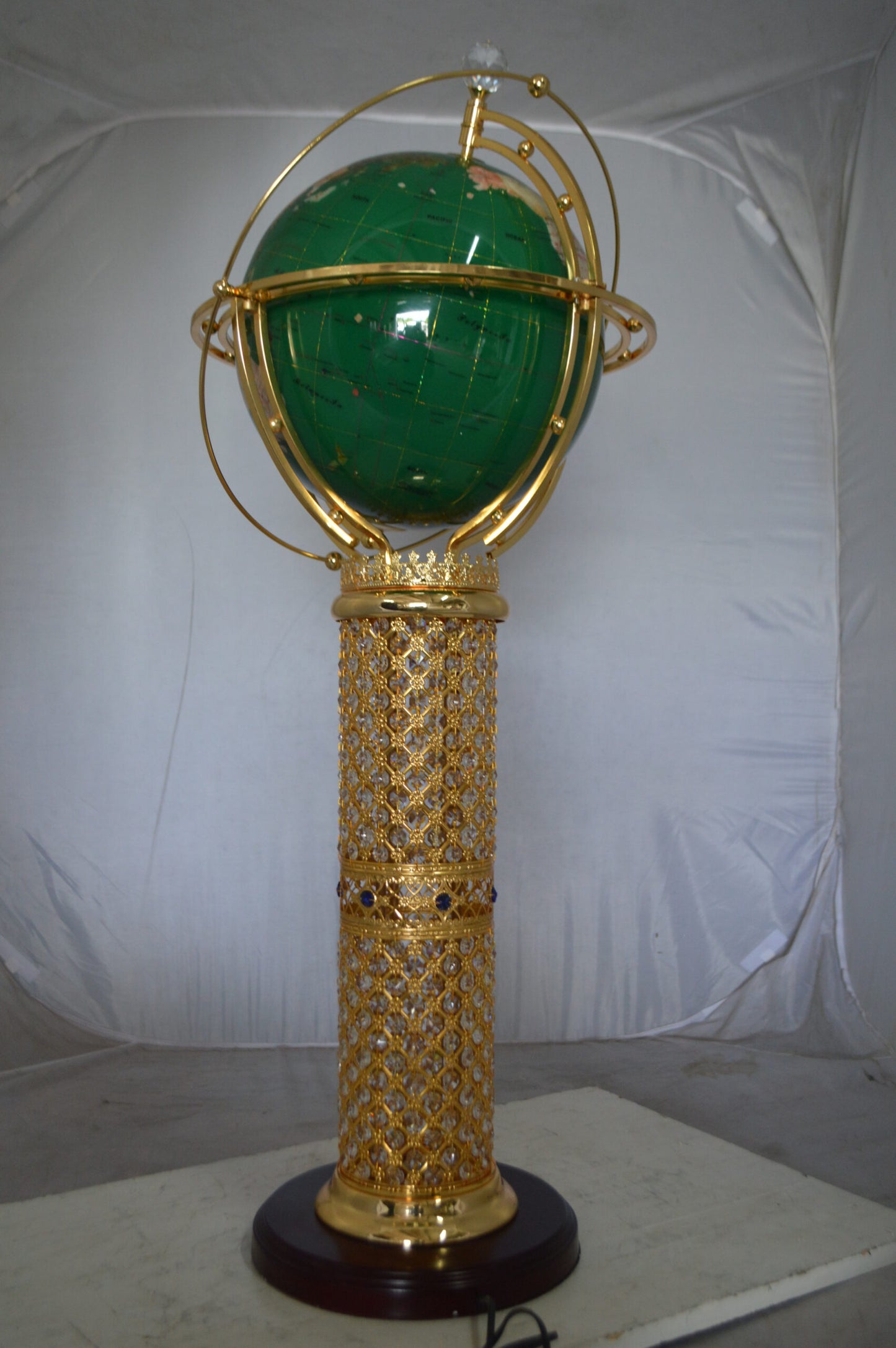 Illuminated Green World Globe Rotated by motor -  Size: 19"L x 19"W x 42"H.