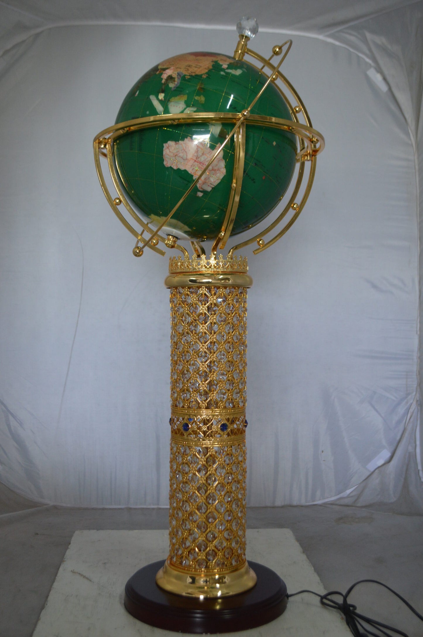 Illuminated Green World Globe Rotated by motor -  Size: 19"L x 19"W x 42"H.