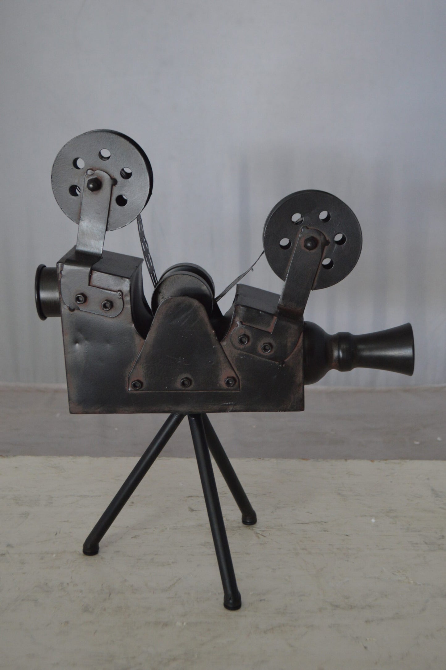 Movie Reel Abstract Metal Statue on tripod -  Size: 12"L x 6"W x 15"H.