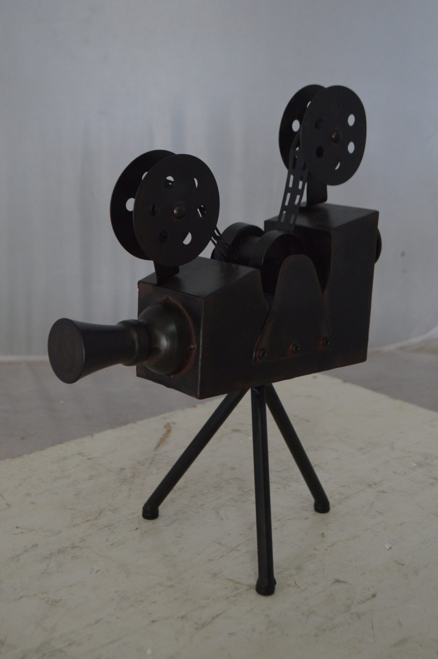 Movie Reel Abstract Metal Statue on tripod -  Size: 12"L x 6"W x 15"H.