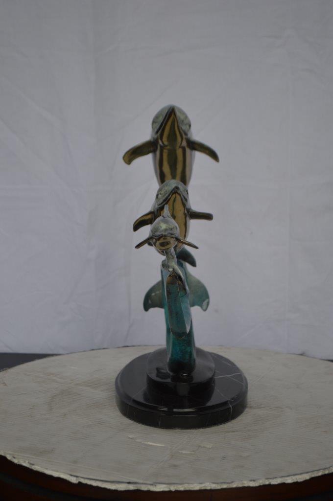 Three dolphins swimming bronze state -  Size: 26"L x 7"W x 16"H.