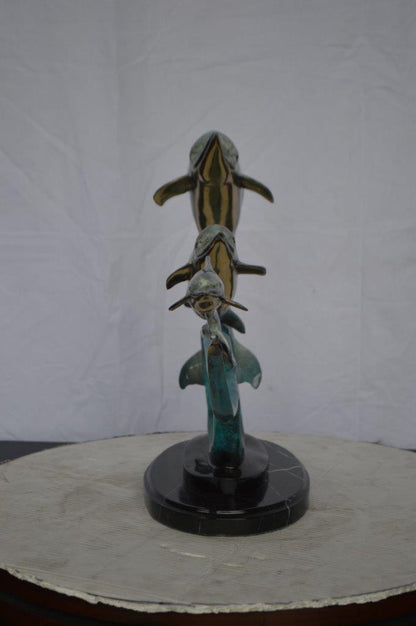Three dolphins swimming bronze state -  Size: 26"L x 7"W x 16"H.