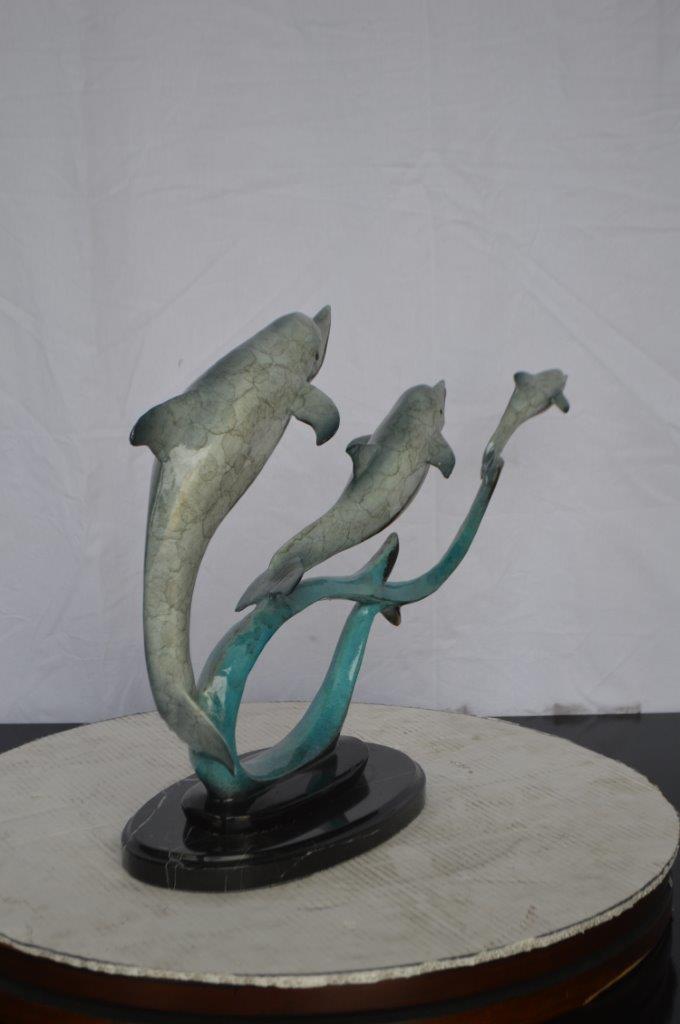 Three dolphins swimming bronze state -  Size: 26"L x 7"W x 16"H.