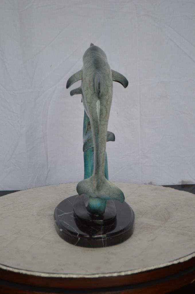 Three dolphins swimming bronze state -  Size: 26"L x 7"W x 16"H.