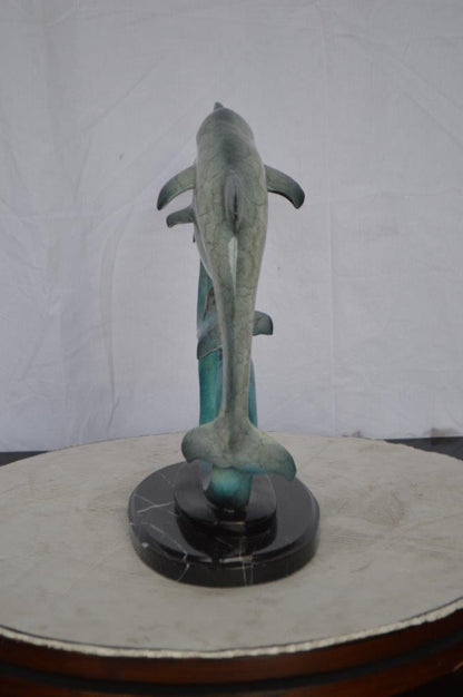 Three dolphins swimming bronze state -  Size: 26"L x 7"W x 16"H.