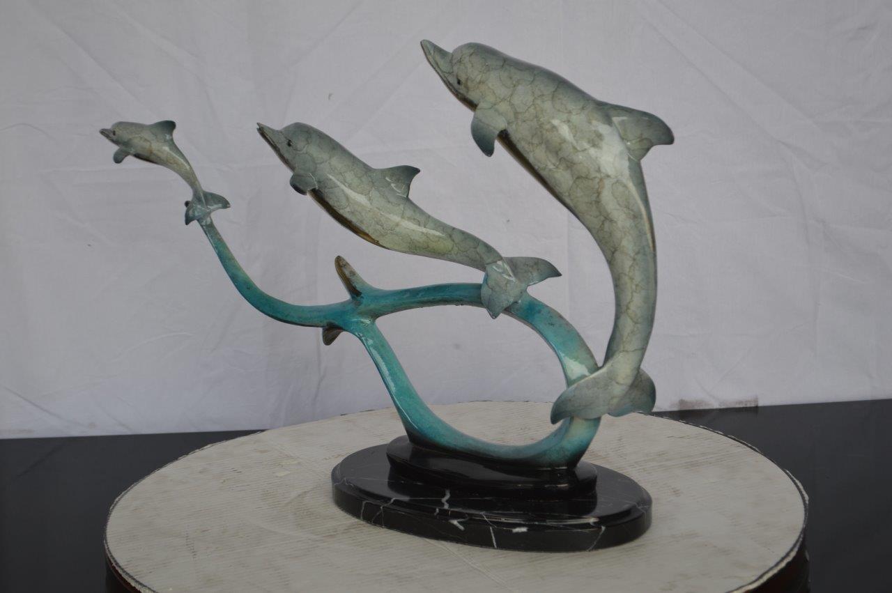 Three dolphins swimming bronze state -  Size: 26"L x 7"W x 16"H.