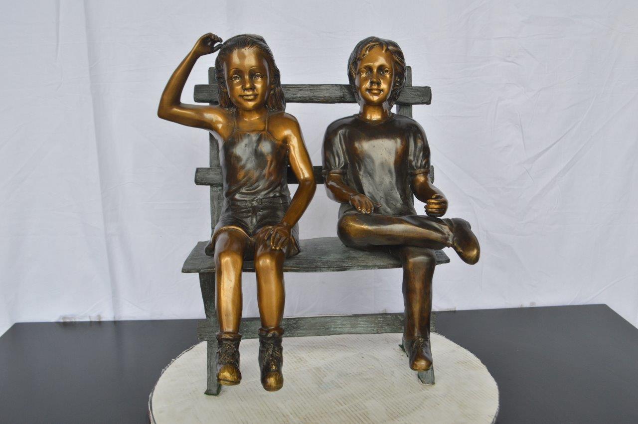 Two Kids Sitting On a Bench Bronze Statue -  Size: 20"L x 18"W x 24"H.