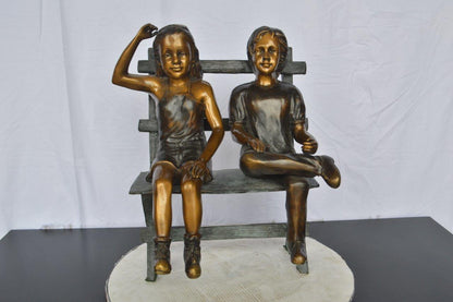 Two Kids Sitting On a Bench Bronze Statue -  Size: 20"L x 18"W x 24"H.