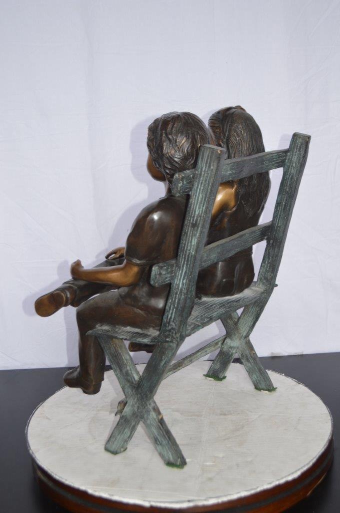Two Kids Sitting On a Bench Bronze Statue -  Size: 20"L x 18"W x 24"H.