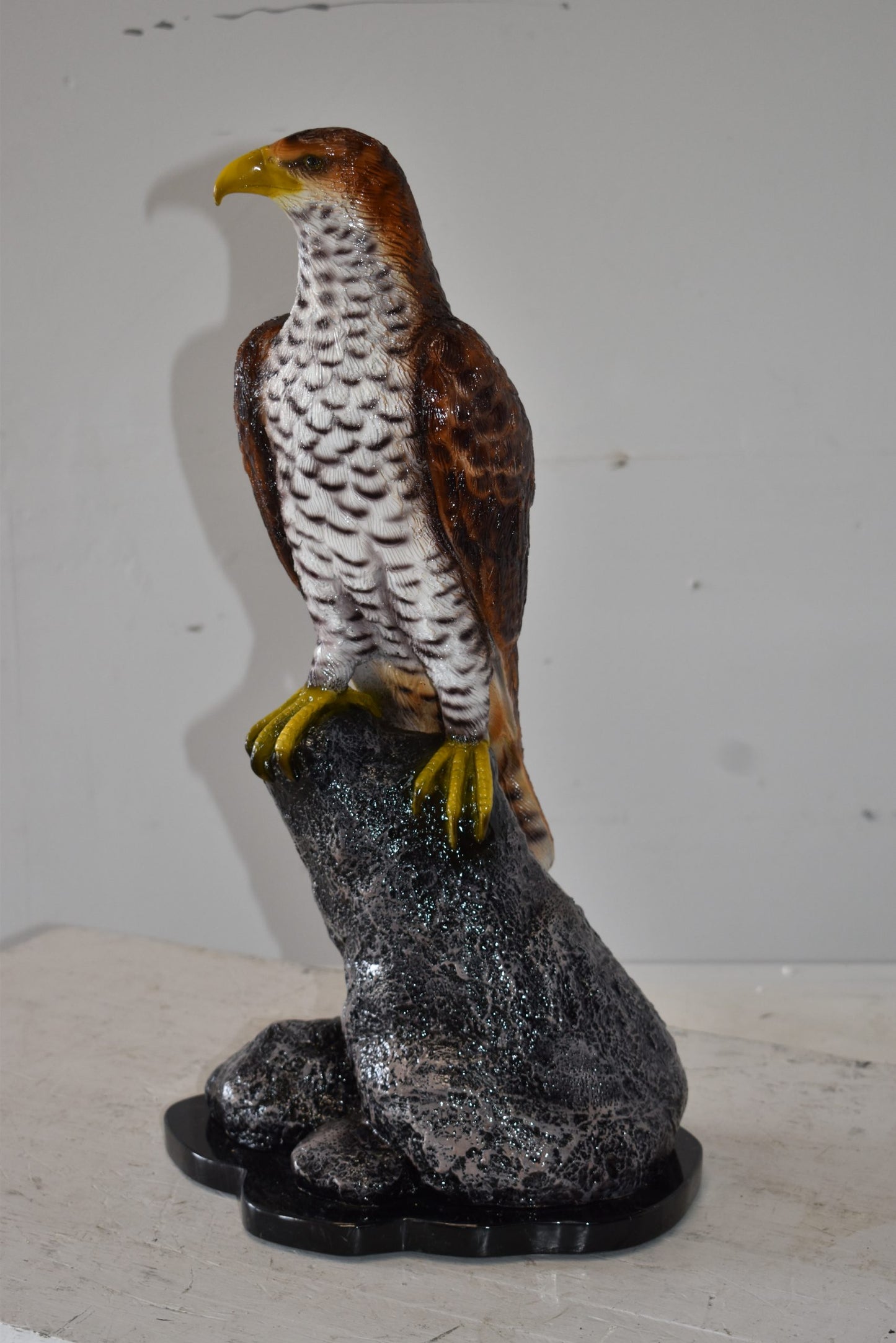 Eagle Standing on a Rock Looking for Prey Size: 10" x 13" x 22"H