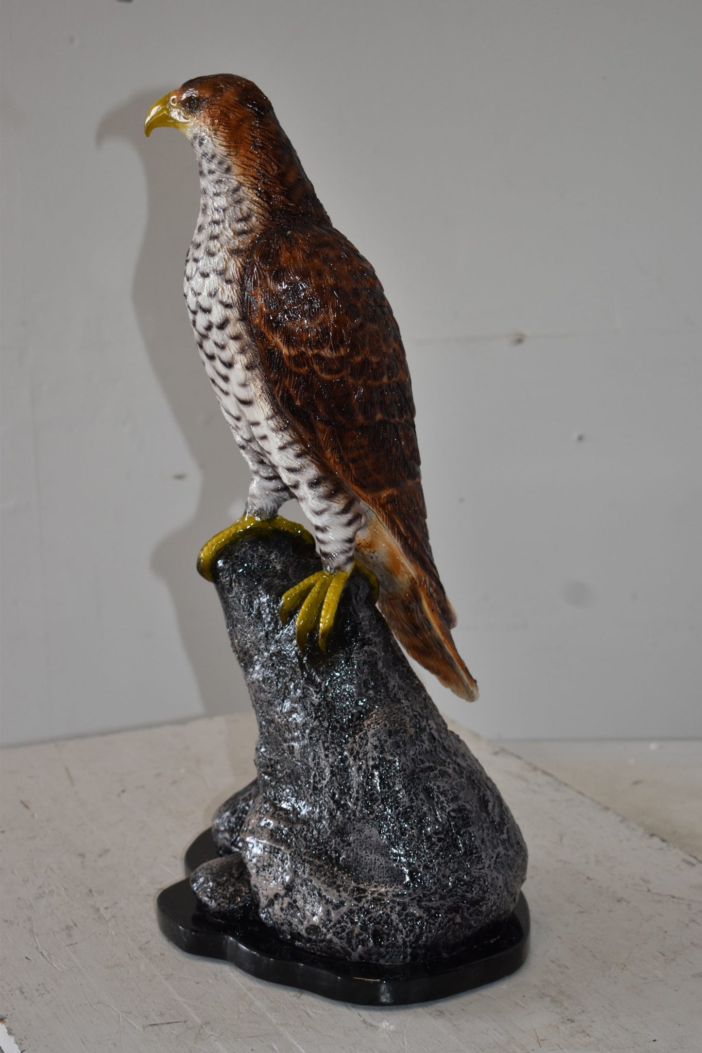 Eagle Standing on a Rock Looking for Prey Size: 10" x 13" x 22"H