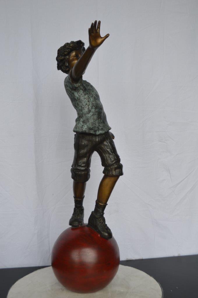 Boy on Ball Bronze Statue - Street Performer -  Size: 23"L x 12"W x 39"H.