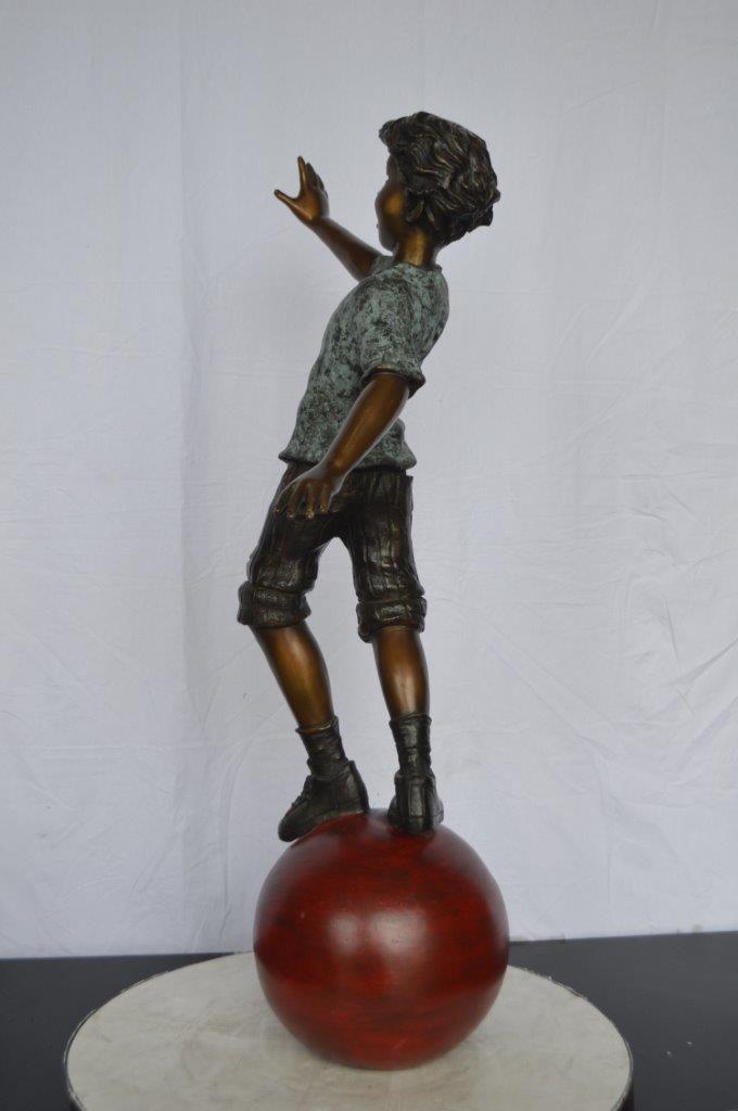 Boy on Ball Bronze Statue - Street Performer -  Size: 23"L x 12"W x 39"H.