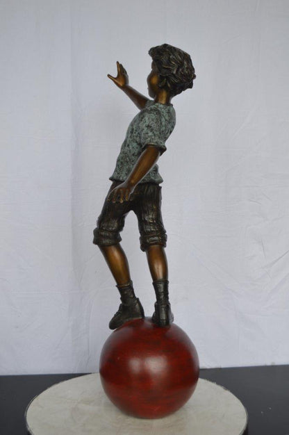 Boy on Ball Bronze Statue - Street Performer -  Size: 23"L x 12"W x 39"H.