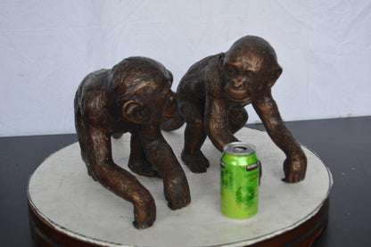 Pair of monkeys looking at each other bronze statue -  Size: 23"L x 7"W x 11"H.