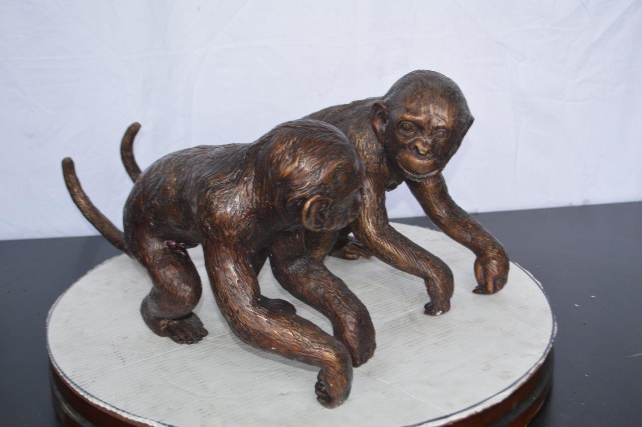Pair of monkeys looking at each other bronze statue -  Size: 23"L x 7"W x 11"H.