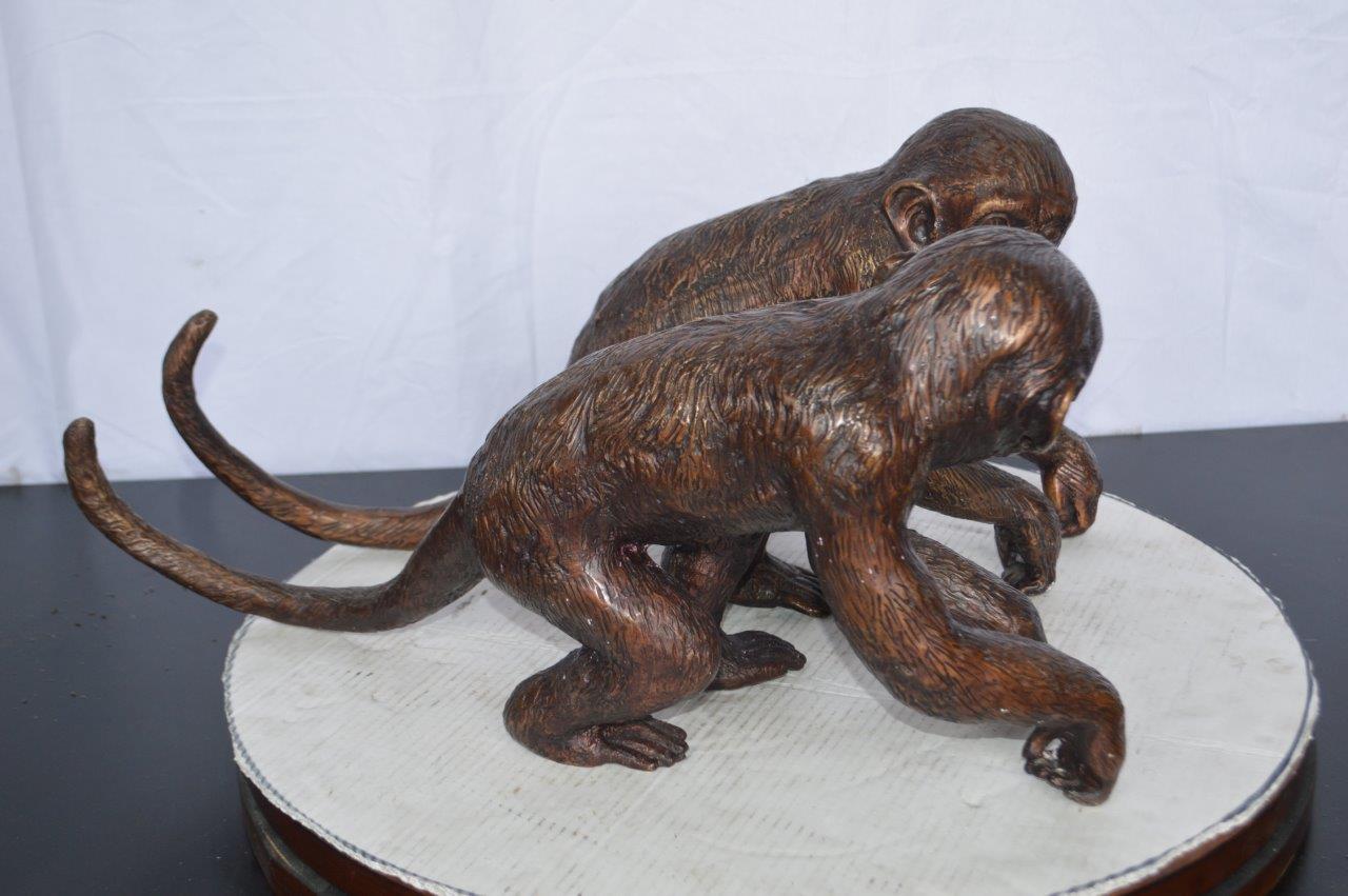 Pair of monkeys looking at each other bronze statue -  Size: 23"L x 7"W x 11"H.