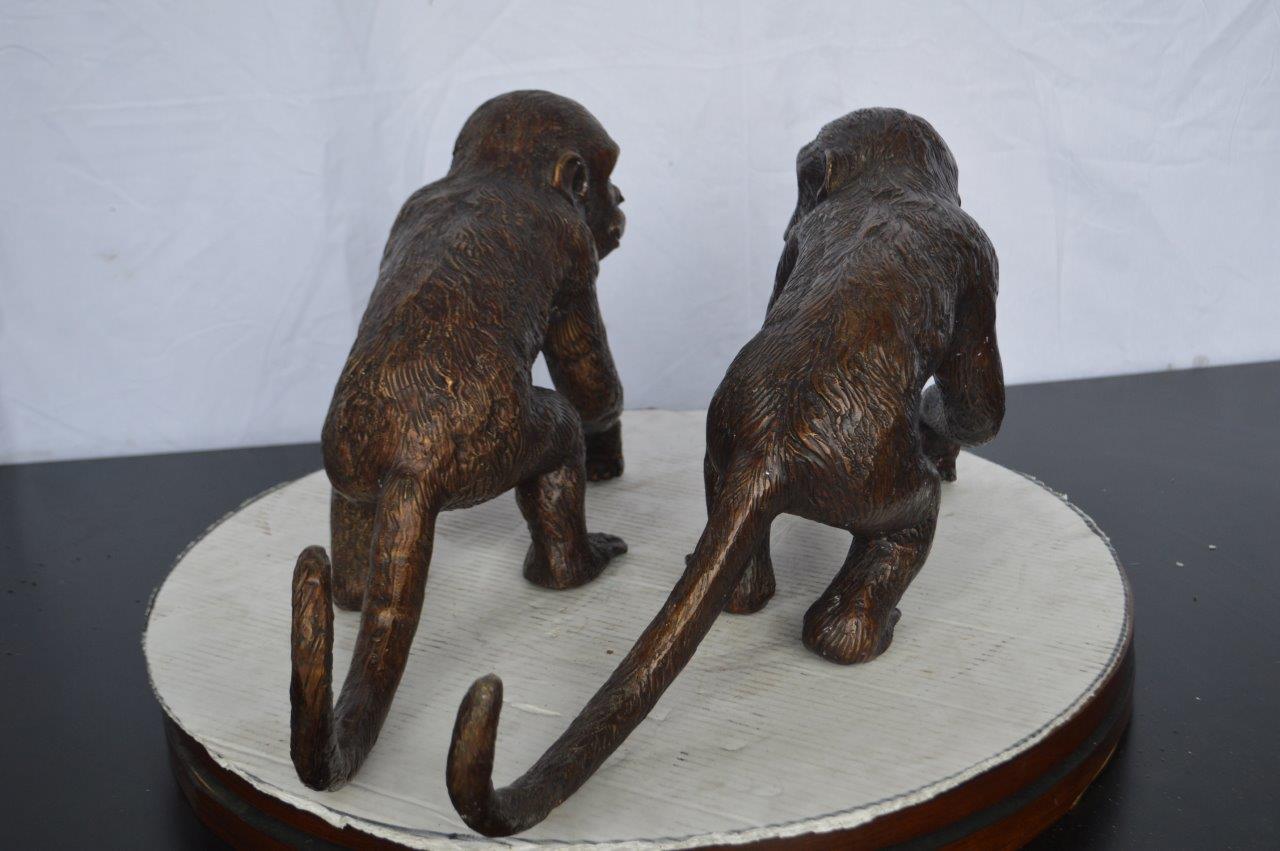 Pair of monkeys looking at each other bronze statue -  Size: 23"L x 7"W x 11"H.