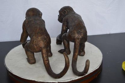 Pair of monkeys looking at each other bronze statue -  Size: 23"L x 7"W x 11"H.