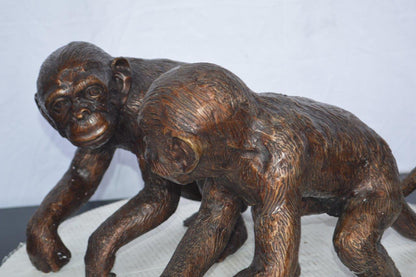 Pair of monkeys looking at each other bronze statue -  Size: 23"L x 7"W x 11"H.