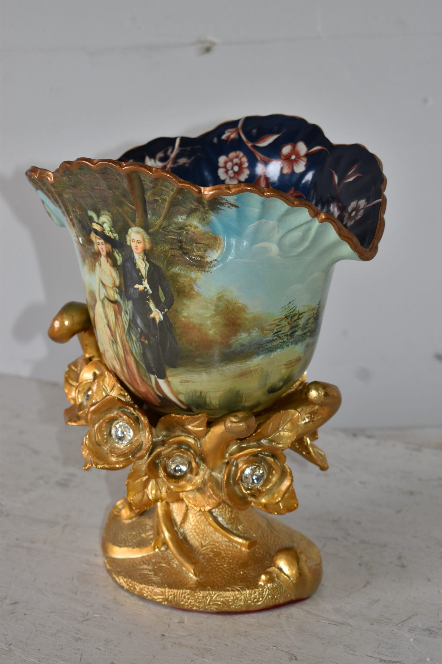 Blossoming Resin Vase with Mr. William Hallett Design Size: 9" x 8" x 12"H