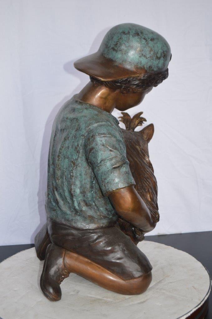 Young Child Playing With His Dog Bronze Statue -  Size: 18"L x 17"W x 26"H.