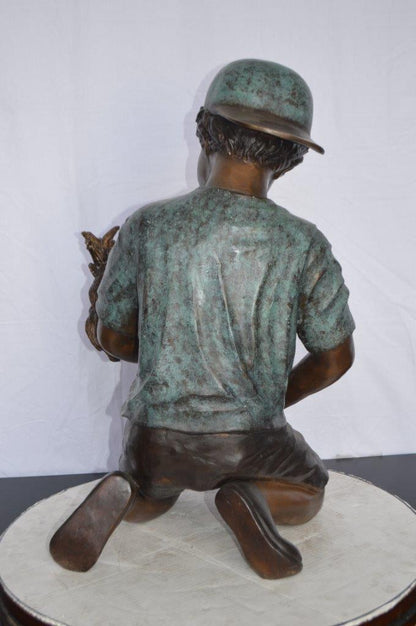 Young Child Playing With His Dog Bronze Statue -  Size: 18"L x 17"W x 26"H.